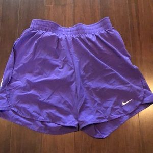 Purple Nike running shorts